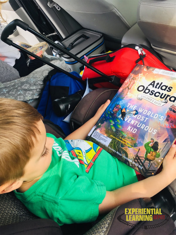 learning activities for road trips - a student reading a book 