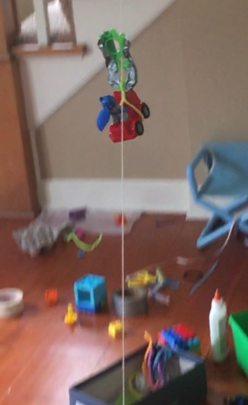 This is a photo of my four year old doing a STEM activity. He finally got batman across the zipline. STEM is for ALL ages! 