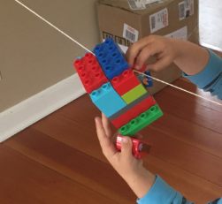 This is a photo of my four year old doing a STEM activity. STEM is for ALL ages! 